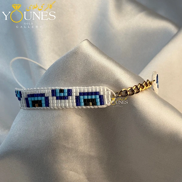 تصویر دوم دستبند میوکی سفید آبی کارتیر طلا